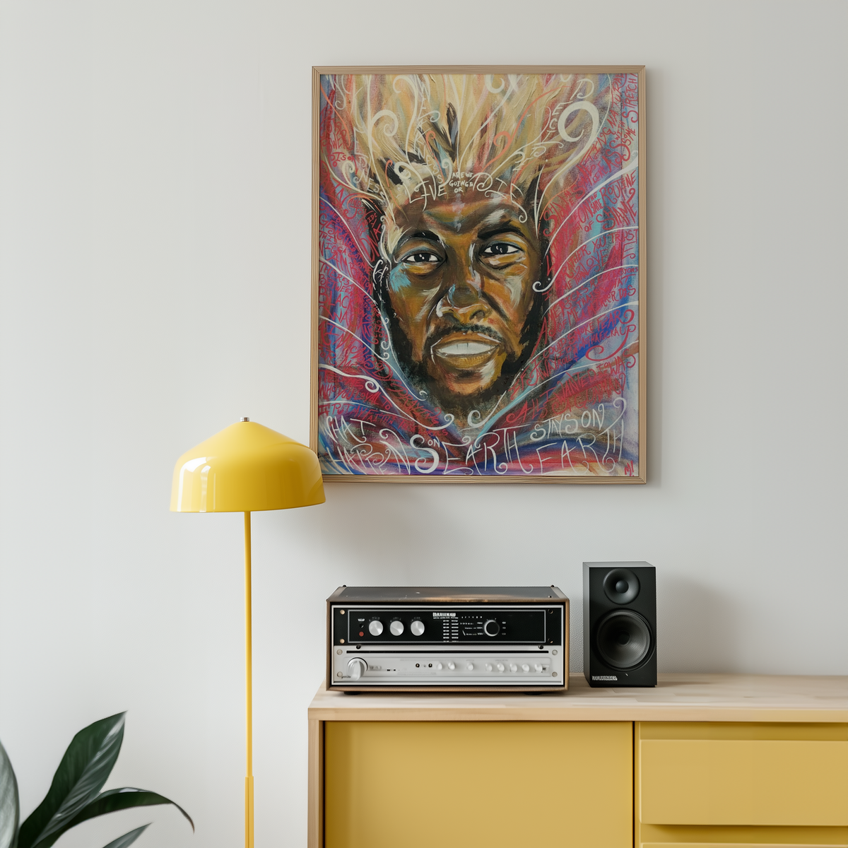 Large framed DAMN. print hanging on a wall