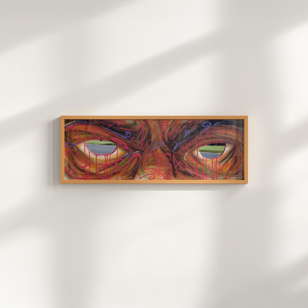 Leyes by Monty, black artwork print in a frame leaning against a wall