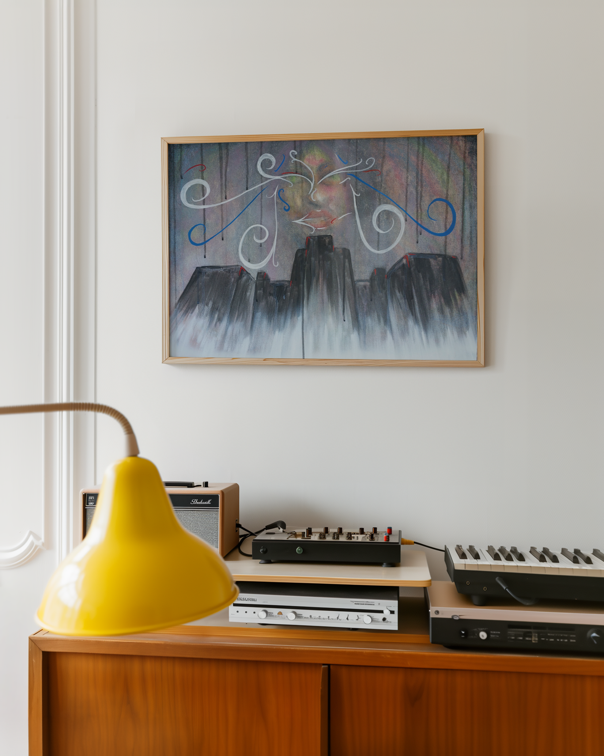 Medium charity hospital art print hanging above a record player