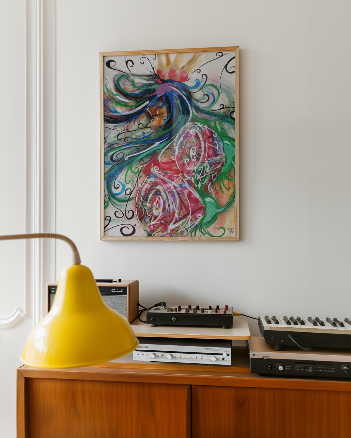 Medium queen of hearts art print hanging above a record player