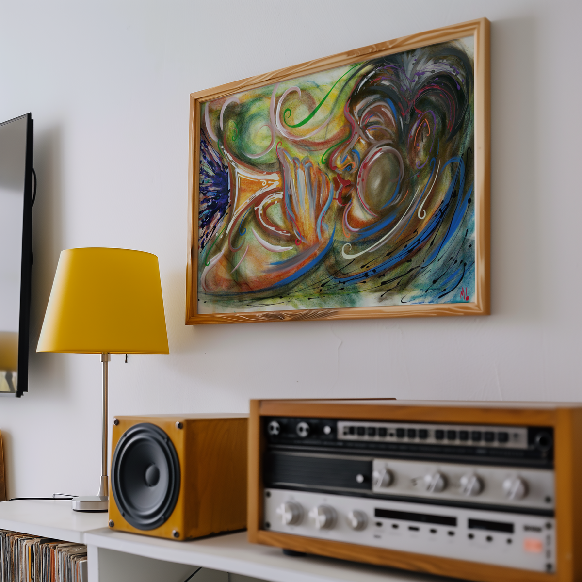 Medium framed black jazz art print of a trumpet player hung above a record player