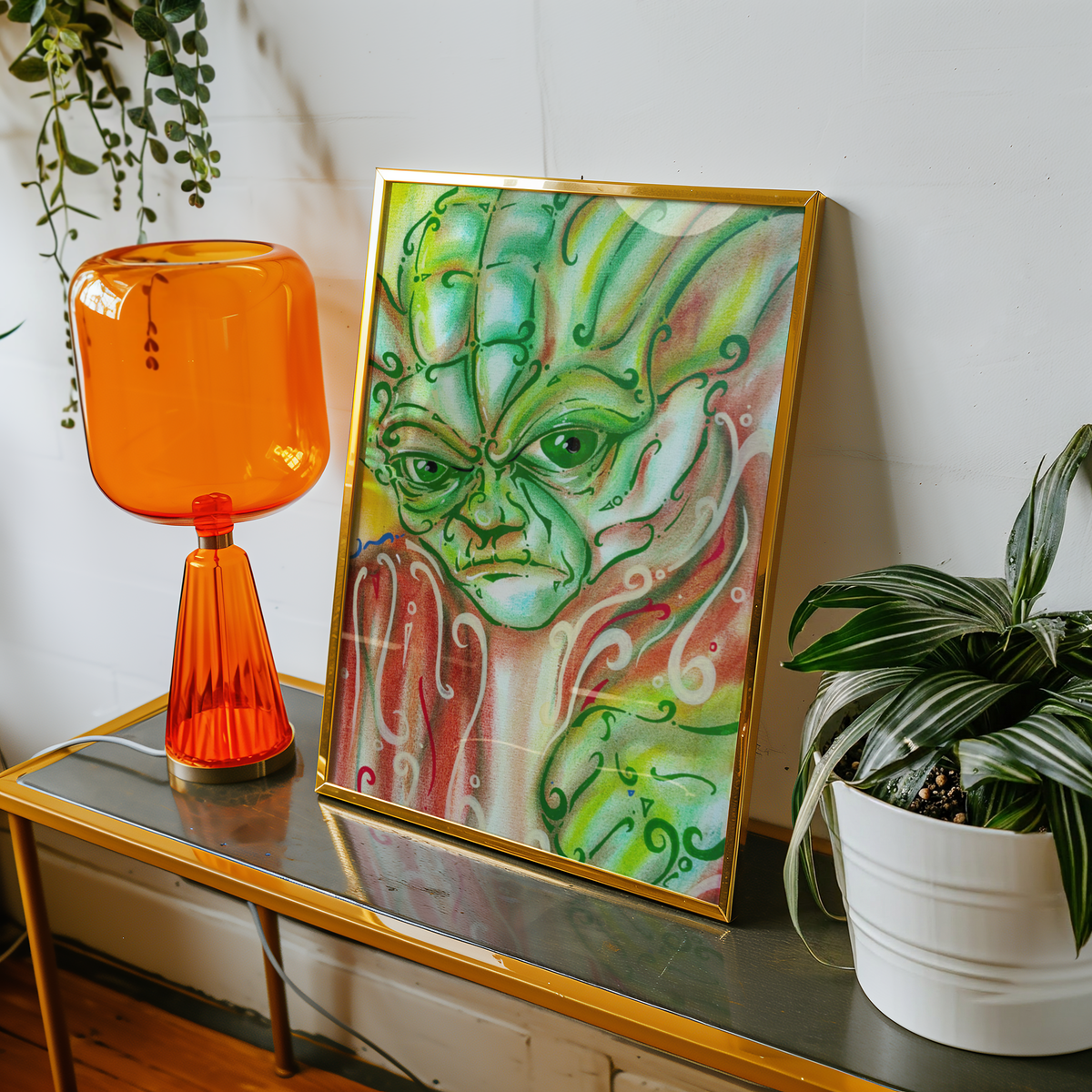 Small framed green wall art print on a table, sci-fi decor